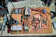 The
                sort-of-completed 10 GHz transverter, the various
                modules being screwed down to a piece of plywood.