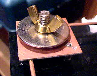 Close-up view of the radial mounting hardware, shown in the stow position.